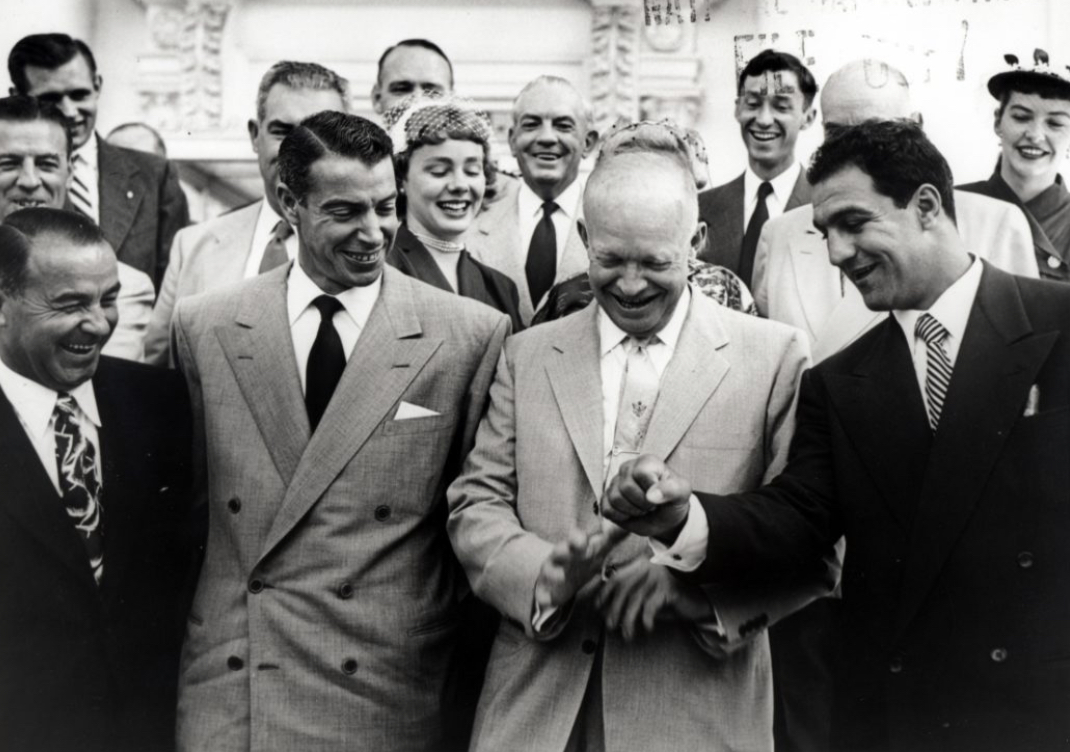 Dwight D. Eisenhower posing for press photos with Rocky Marciano and Joe Dimaggio.