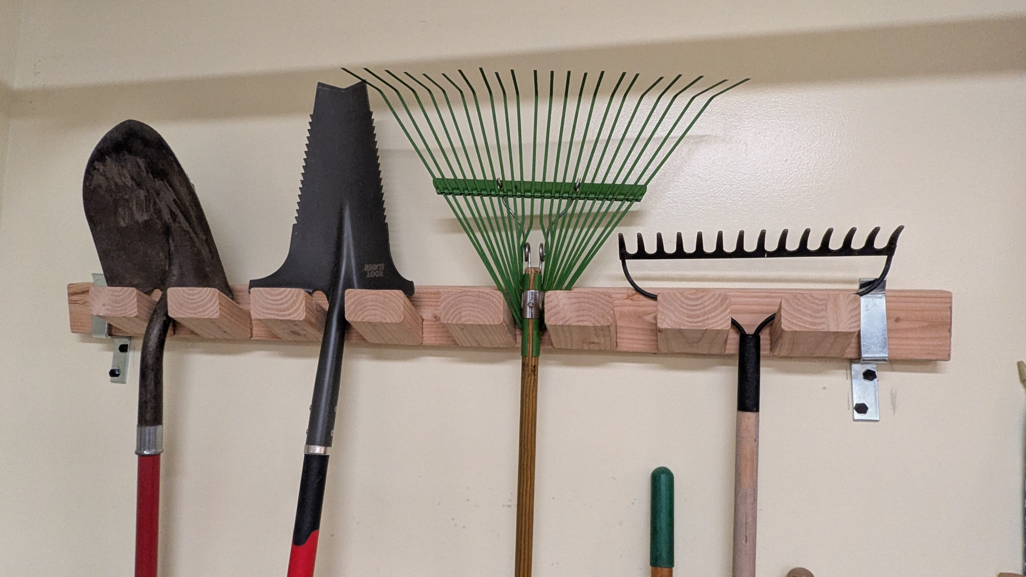 Plans for a garden tool rack that can be built with only a single 2x4