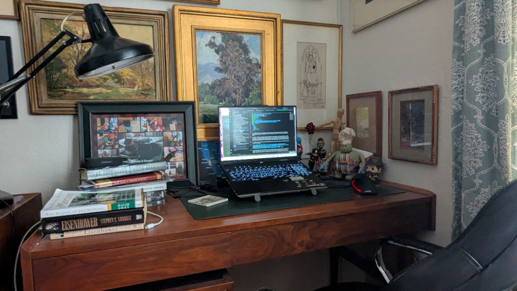 A picture of my work area in the corner of my bedroom. I'd like to call it an office, but I think that's being generous.